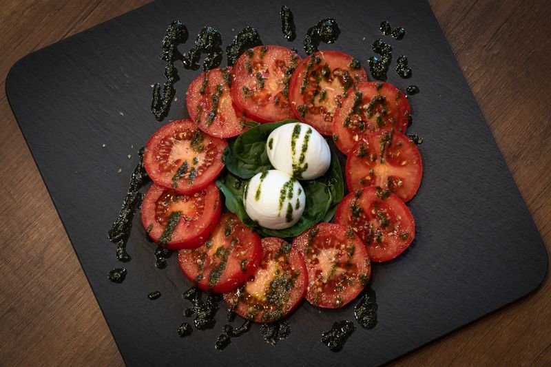 Caprese Salad with fresh mozzarella, tomatoes and basil