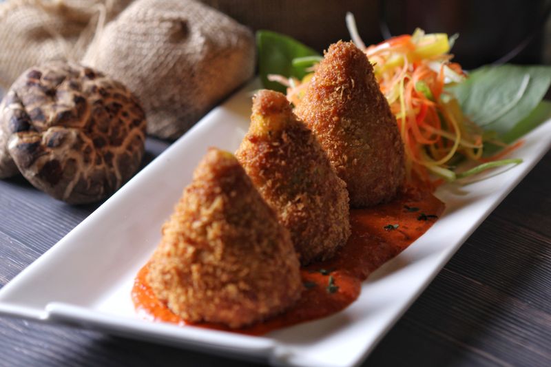 Crispy Arancini Italian rice balls with marinara sauce